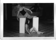 Rajni and Jill rest balance around a plinth, photo by Todd Carroll